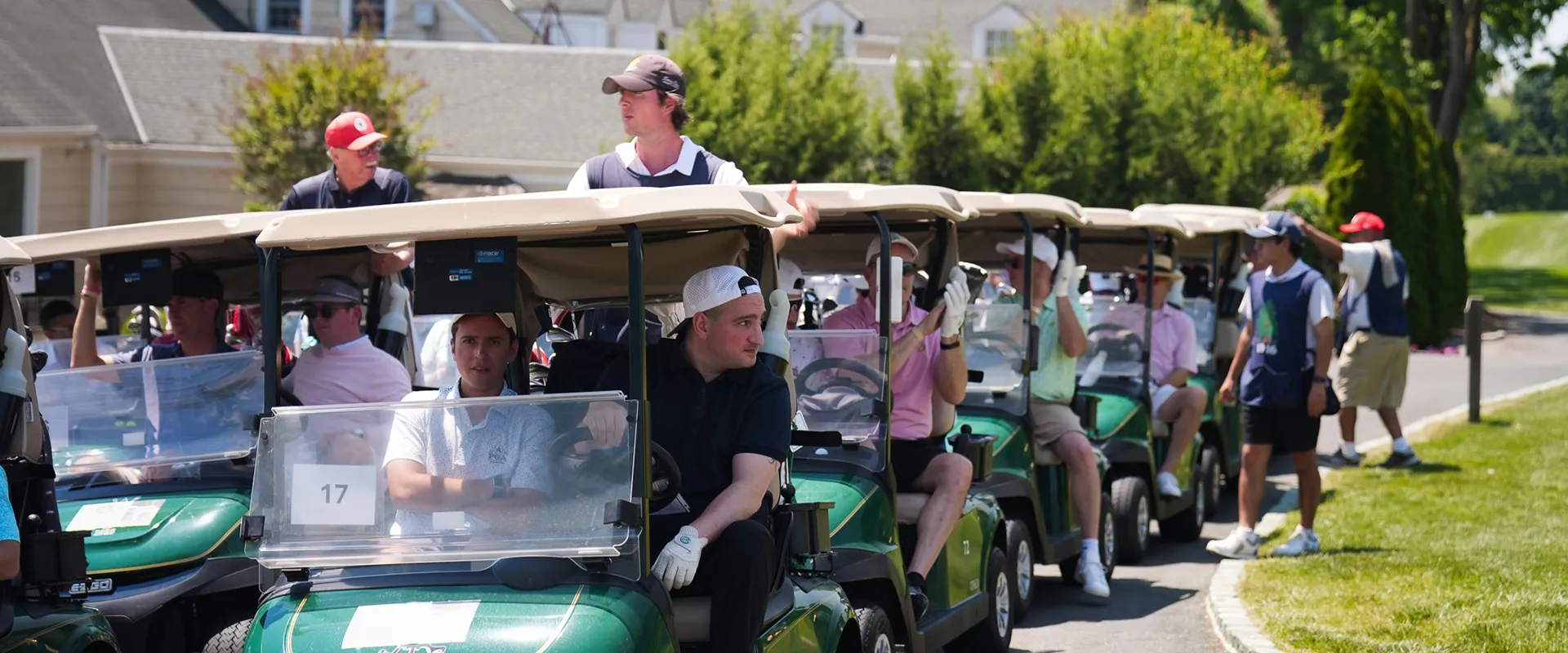 Golfers lined up in golf carts during the 2026 Smile Farms Golf Outing.